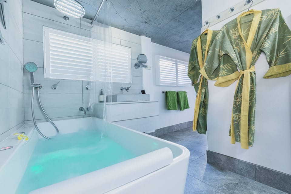Well proportioned and stylish spa room fluffy bath sheets and cotton robes. 