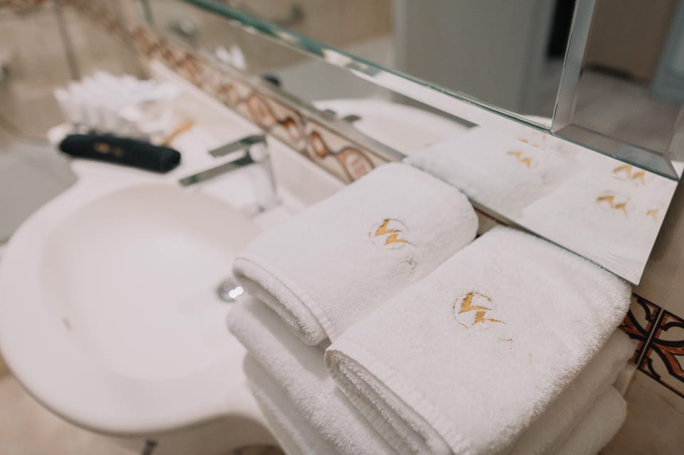 Superior Quadruple Room | Bathroom | Hair dryer, slippers, towels, soap