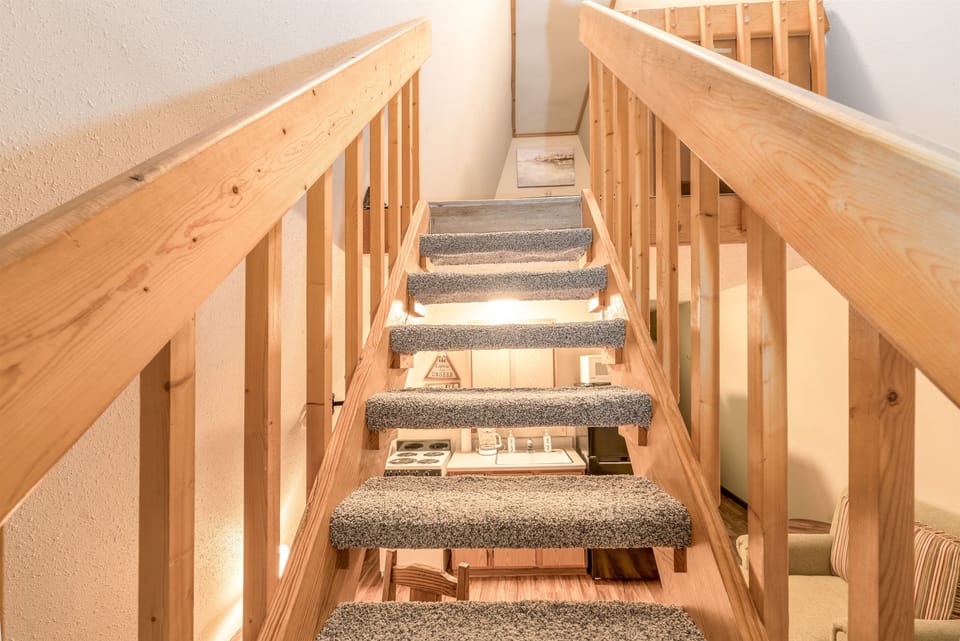 The queen bed is located on the loft level