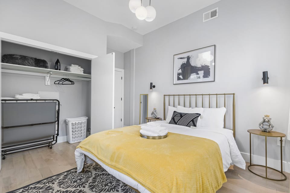 Relax in this sunlit bedroom featuring abundant natural light and a TV for your entertainment needs.
