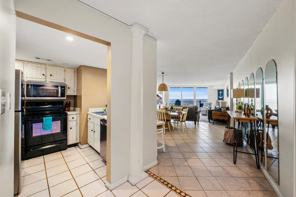 The fully equipped kitchen flows into the bright and airy dining space, making it easy to cook and gather with family or friends.