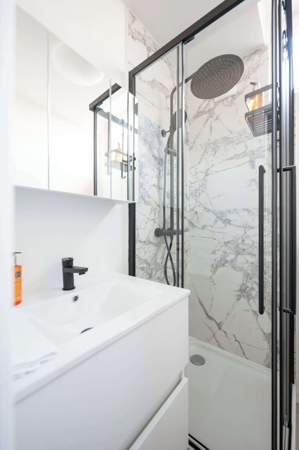 The bathroom is fully stocked with towels, toilet paper, soap, shampoo and cabinet space to store your bathroom essentials for your convenience