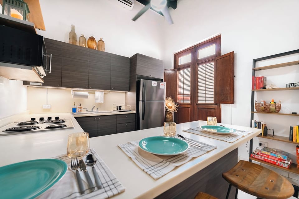 Kitchen & Peninsula · Open, social layout with bar seating for meals and convers