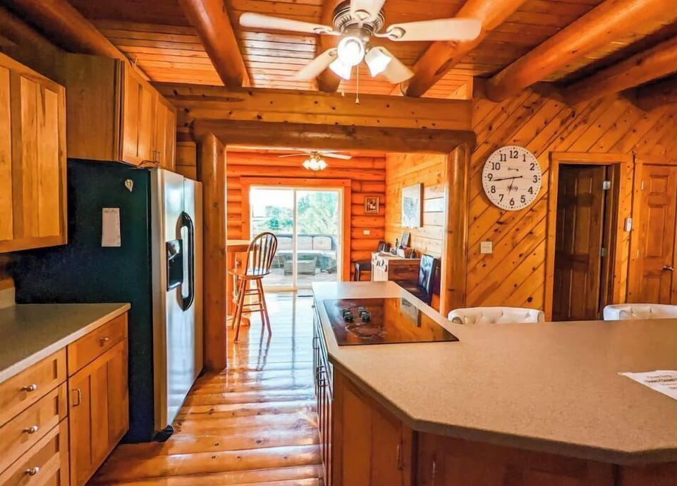 Kitchen overlooking breakfast nook and wrap around porch