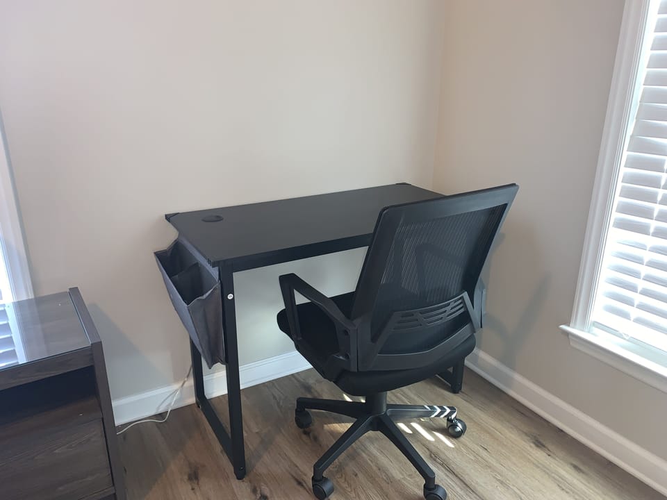 Dedicated work desk with adjustable chair. 