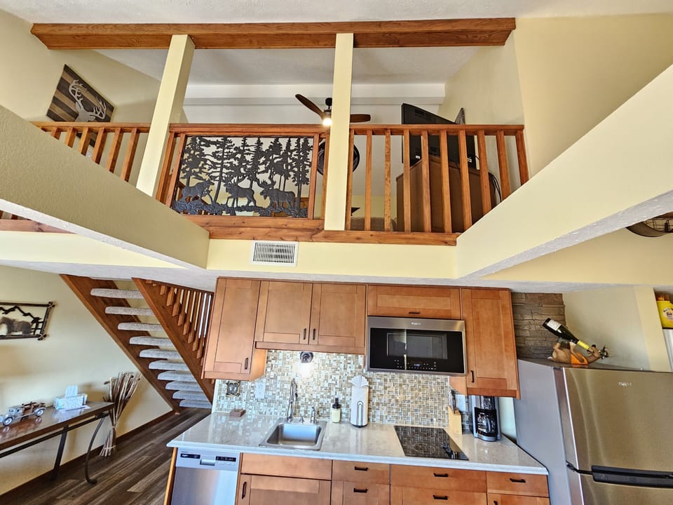 The Spare Bedroom loft beautifully overlooks the kitchen & living room!