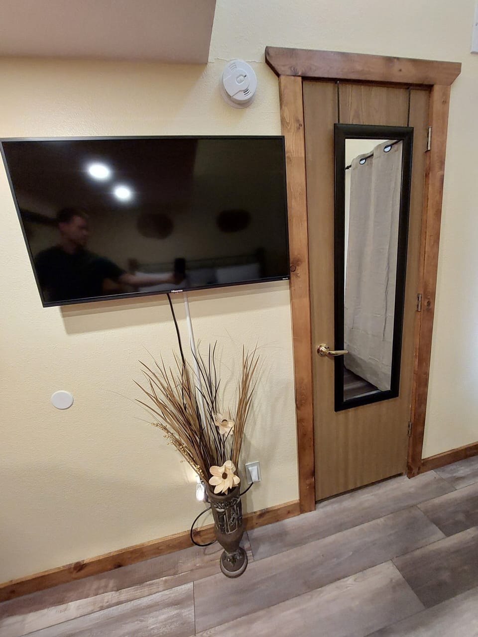 Big Screen Smart TV, unique decor, and Large Mirror across from your Master Bed!