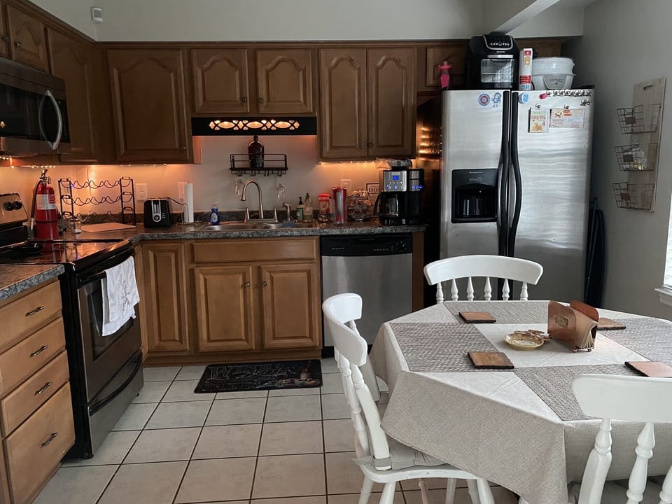 Full Kitchen with stove, oven, microwave, dishwasher & refrigerator/freezer. 