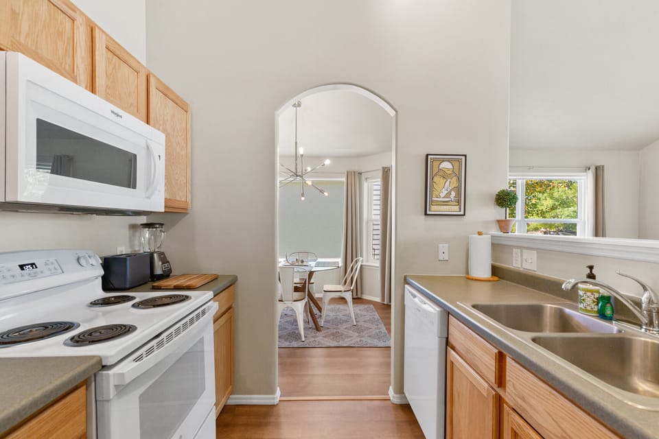 The kitchen has full-sized appliances/dishwasher.