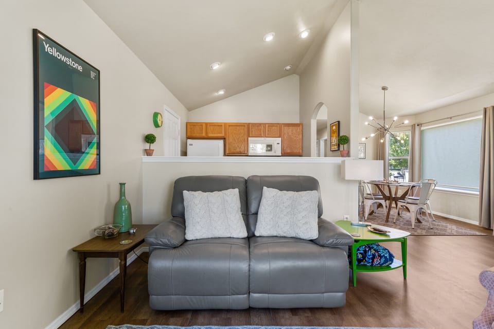 Electric leather sofa. Yellowstone and Sweetpea themed artwork. 