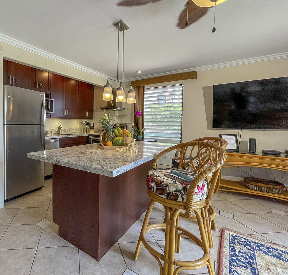 This kitchen is very well equipped for cooking! The large granite counter ensures plenty of extra counter space, and seating for 4.