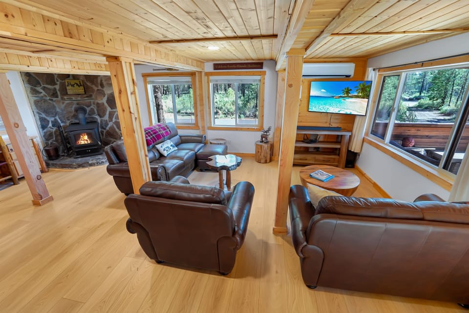 Comfortable open living room with warm wood finishes and natural light