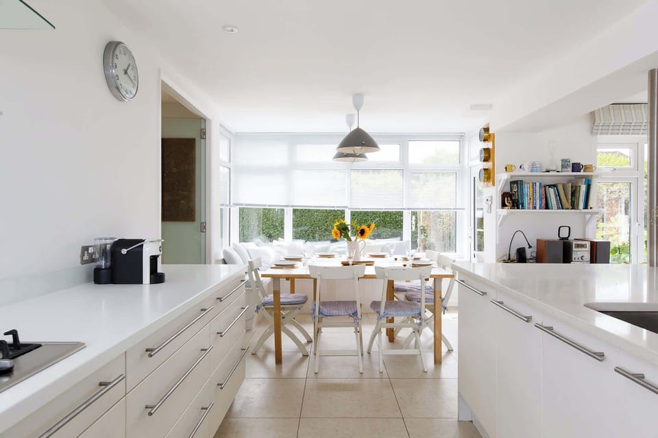 The dining area is connected to the kitchen.