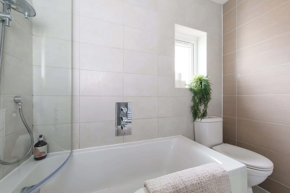 Take a long soak in the bath after a fun filled day spent by the seaside.