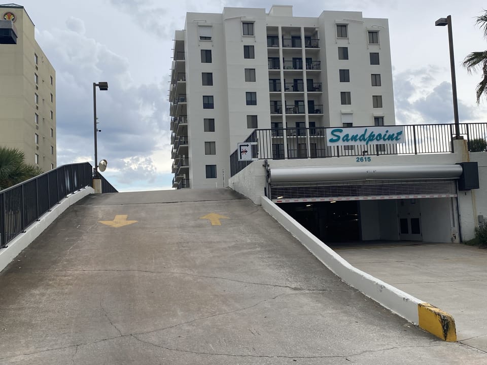 Sandpoint Condominium street entrance and underground parking garage