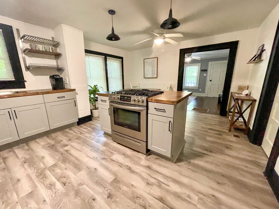 Open kitchen floor plan with island. 