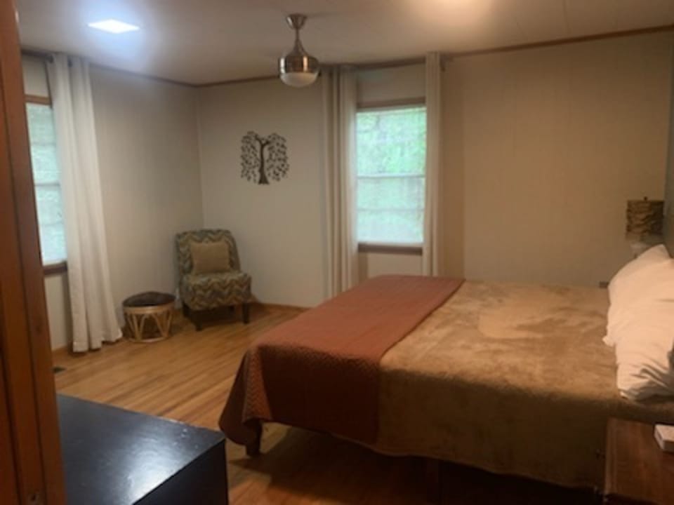 Main floor bedroom with two outside views of forest. Look for the signal tree.