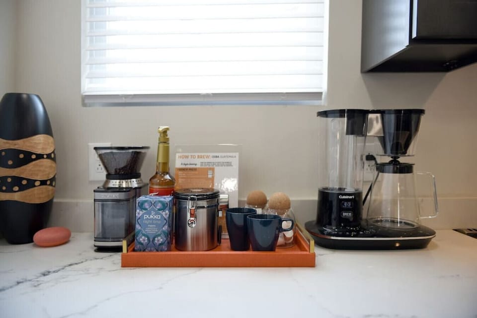 Premium coffee & tea station with drip maker, French press, and local beans