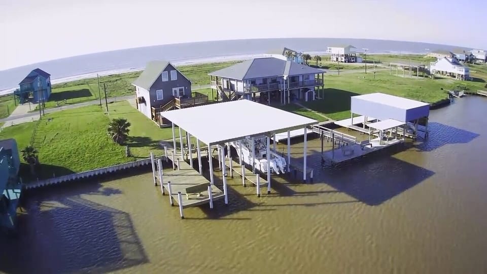 Aerial view of house+boat dock