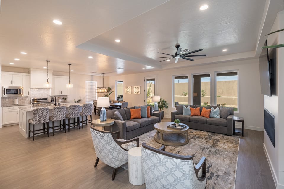 Living Room - The Living Room is located adjacent to the dining room and is the perfect place to relax and watch your favorite movie or TV program.