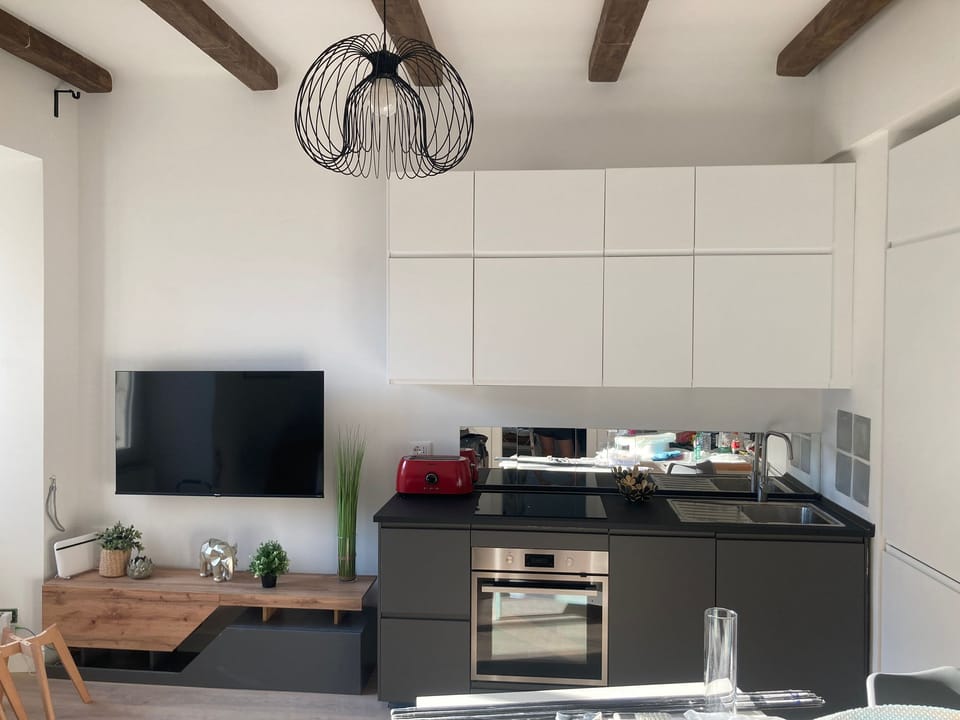 Family Apartment | Living area | 55-inch flat-screen TV with cable channels, TV, toys
