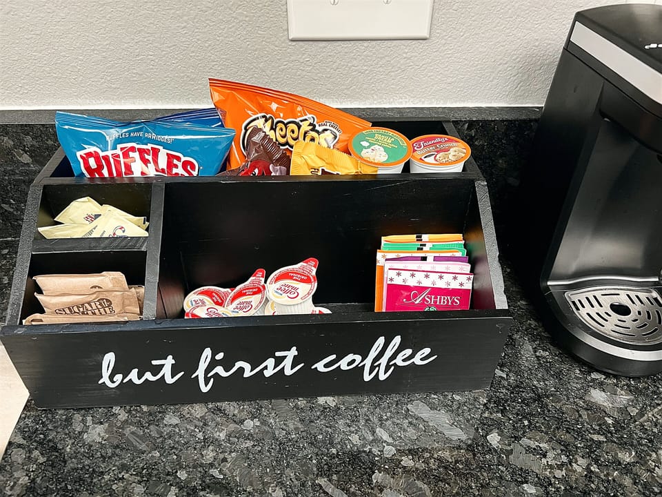A well stocked coffee bar with coffee, teas and snacks for you. 