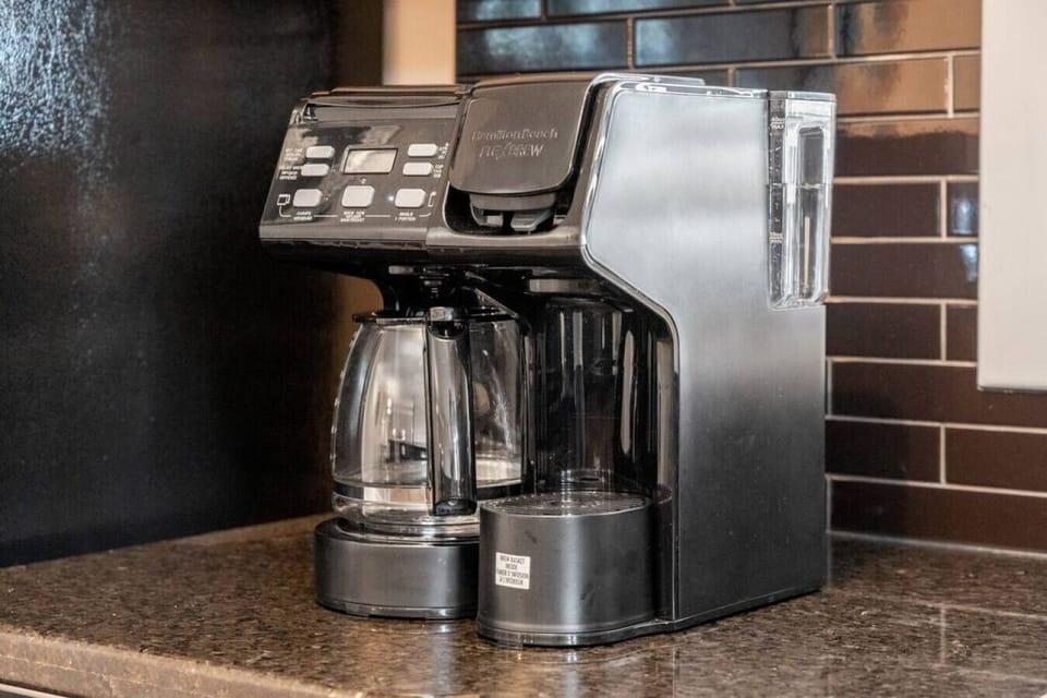 Full kitchen with a drip coffee machine, ground coffee, tea, sugar and basic condiments (ketchup, mustard and relish.)