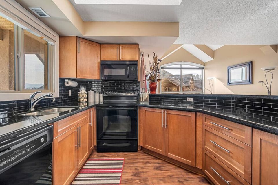 Full kitchen with a drip coffee machine, ground coffee, tea, sugar and basic condiments (ketchup, mustard and relish.)
