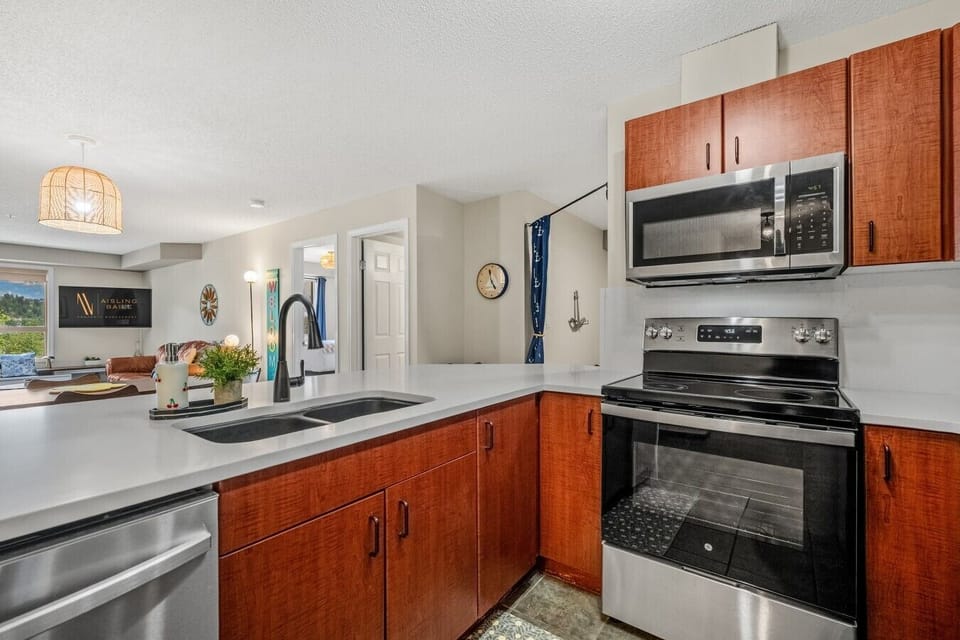 Full kitchen with a drip coffee maker, ground coffee, tea, sugar, and basic condiments (ketchup, mustard & relish.)