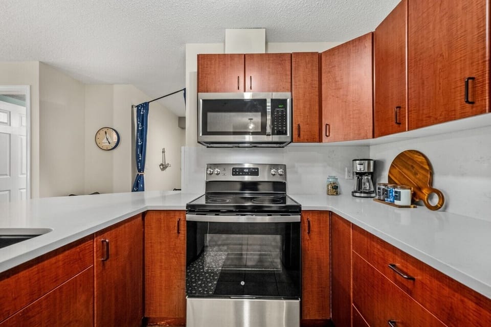 Full kitchen with a drip coffee maker, ground coffee, tea, sugar, and basic condiments (ketchup, mustard & relish.)