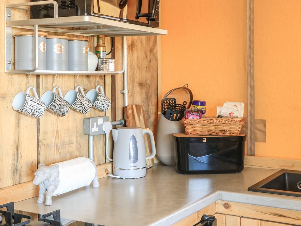 Fridge, electric kettle, cookware/dishes/utensils
