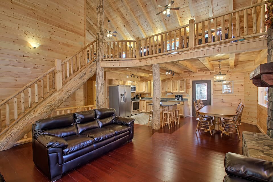 Great Room, with Kitchen and Dining Area beyond, Open Loft above, from SE corner