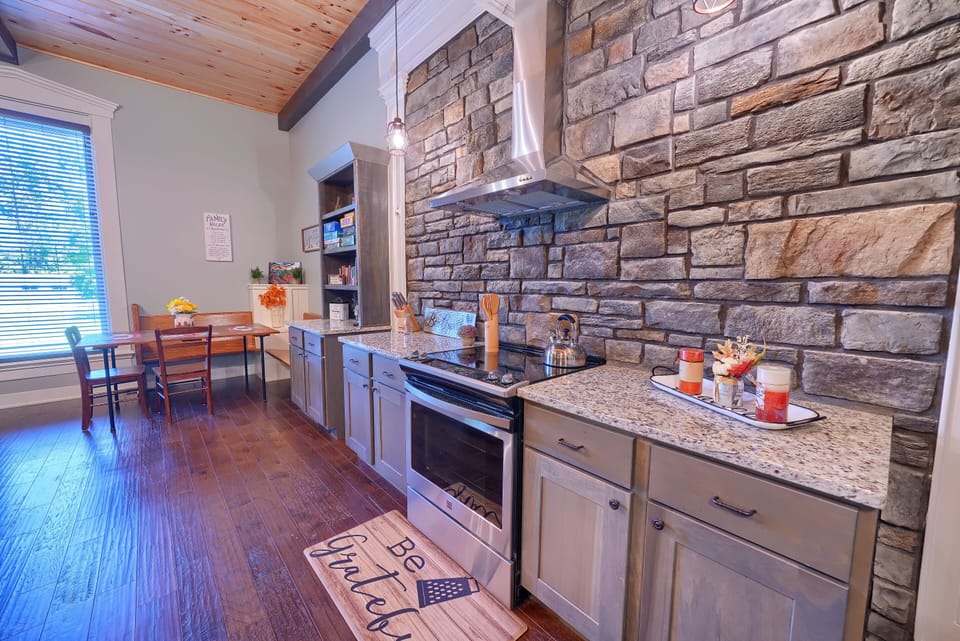 Closeup of Oven and Range, with Breakfast Nook beyond