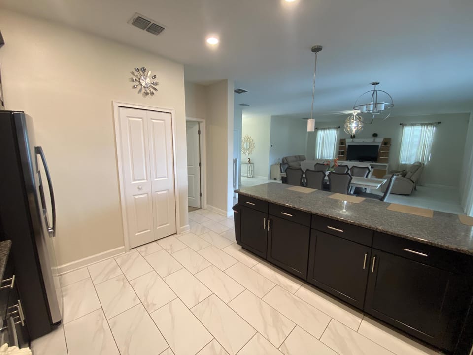 Large pantry and open kitchen perfect for family meals.