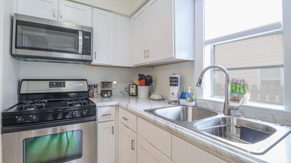Kitchen with traditional & K Kup coffee maker, instant pot, blender, and more