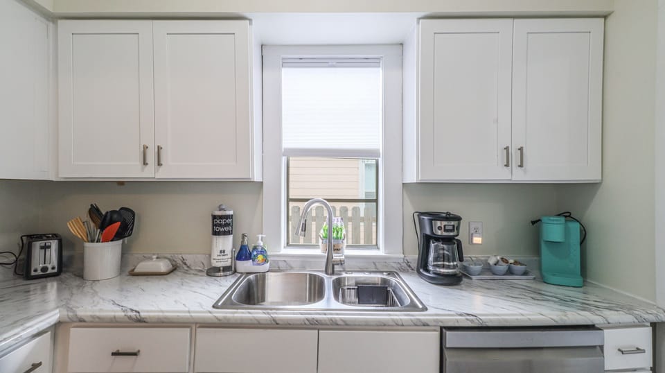 Kitchen with traditional & K Kup coffee maker, instant pot, blender, and more