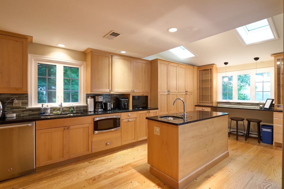 The kitchen contains everything that most people will want: 12 place settings, a variety of pots, pan, and bowls, baking equipment, air fryer, toaster, toaster oven, coffee maker, electric kettle, blender, and much more. 