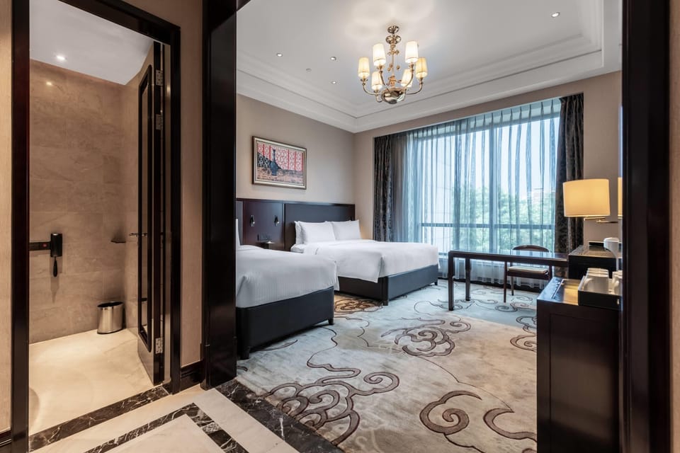 Suite (Comfortable Five-Beds Room) | Down comforters, in-room safe, desk, blackout drapes