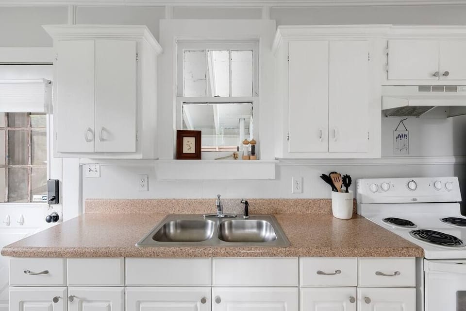 Full kitchen with an electric range and full size fridge
