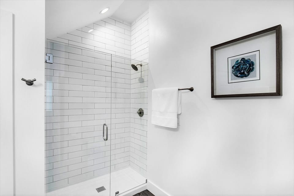 1st Floor bedroom 1. Private bath picture 2. Frameless glass walk-in shower.