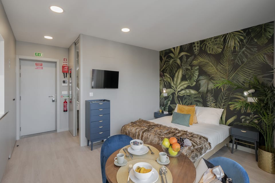 Bedroom with a double bed and a TV