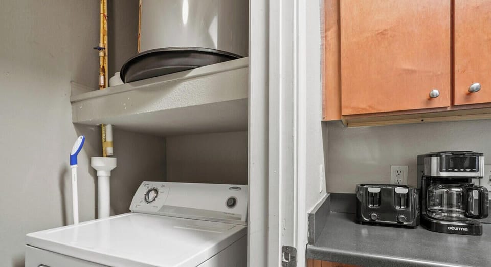 Washer and dryer off of the kitchen