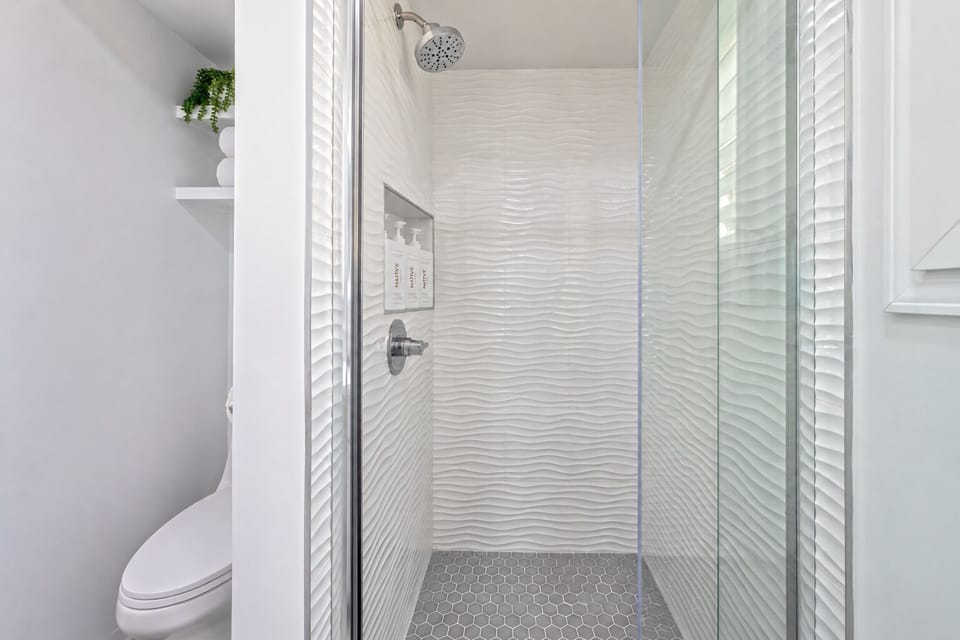 Contemporary bathroom with NATIVE Coconut & Vanilla amenities.