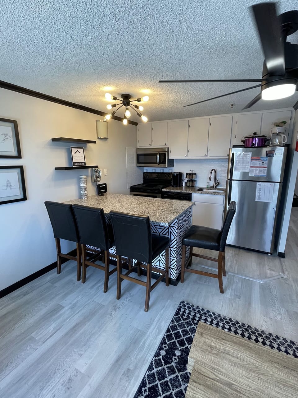 Kitchen and island seating area. 