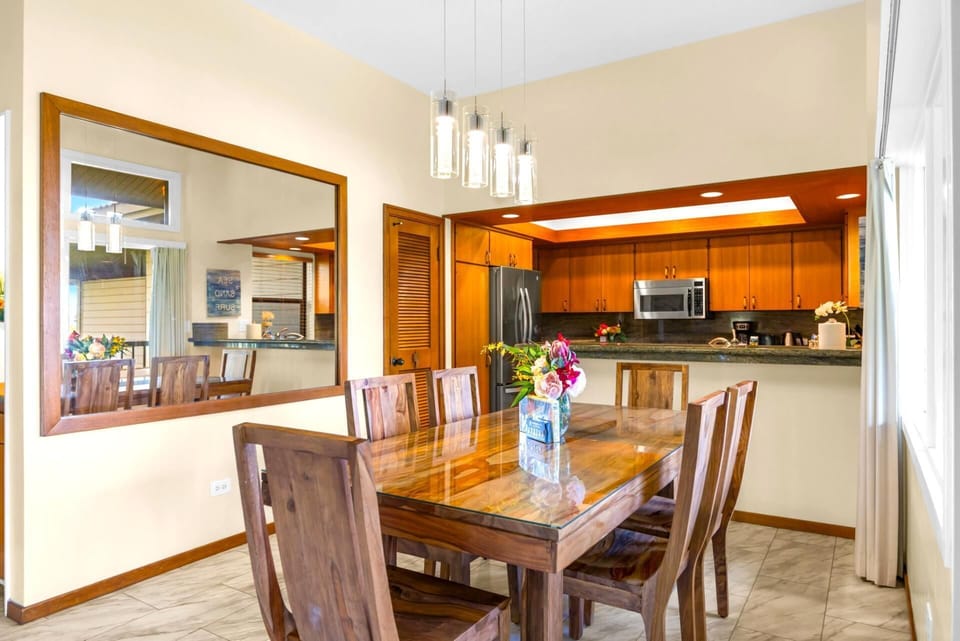 Window-side dining just steps from the kitchen and lanai.