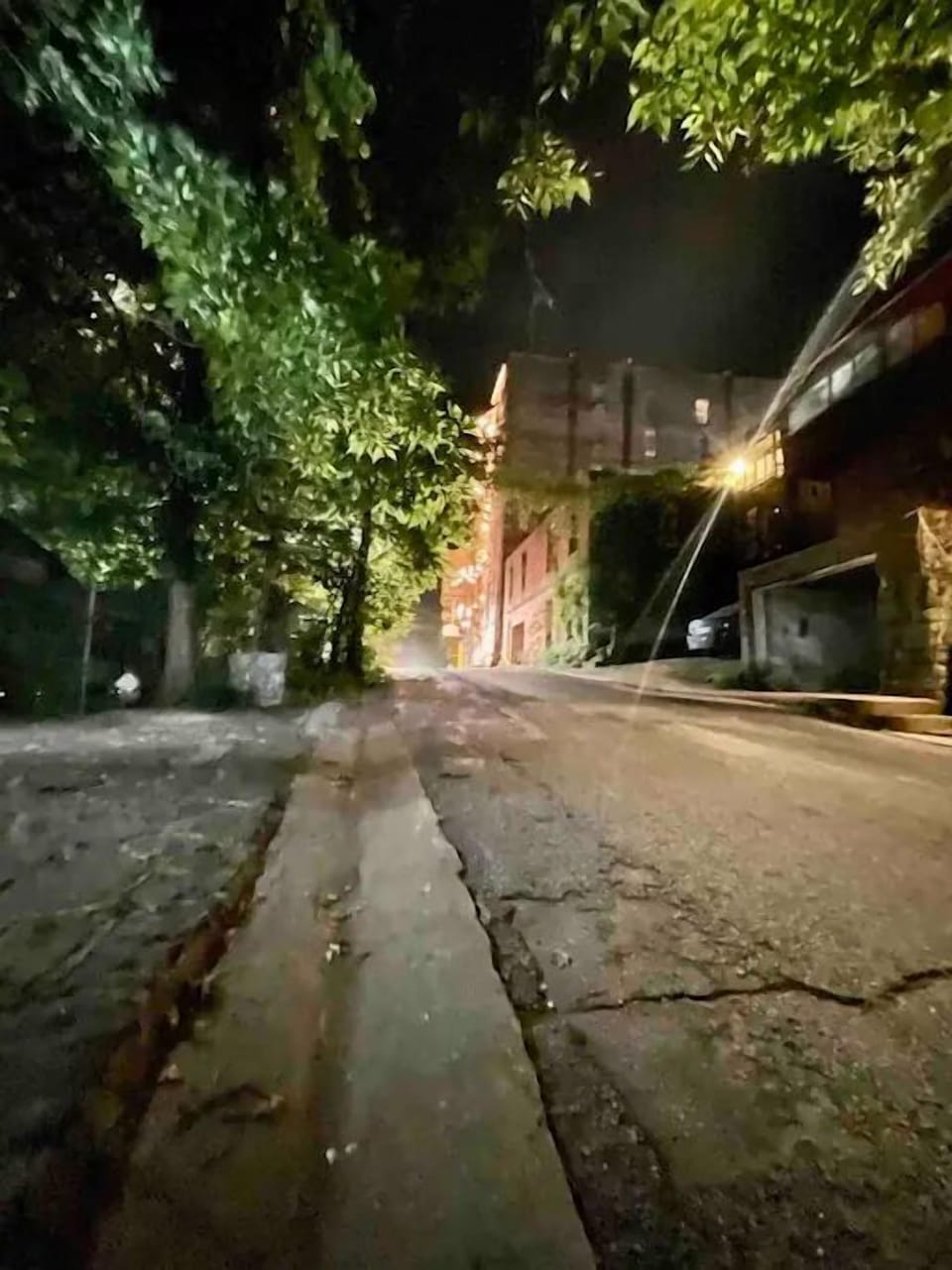 View of Center street at night! The New Orleans hotel is on the right with an abandoned building cou