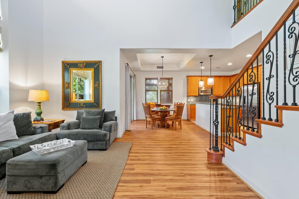 Open concept space connects living room, dining area, and kitchen beautifully.