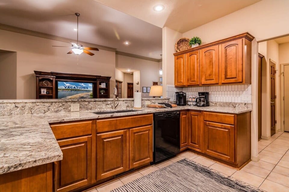 The kitchen is open to the living room so everyone can be a part of the action!