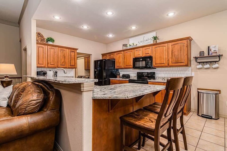 New granite countertops in the kitchen and the cabinets are stocked!
