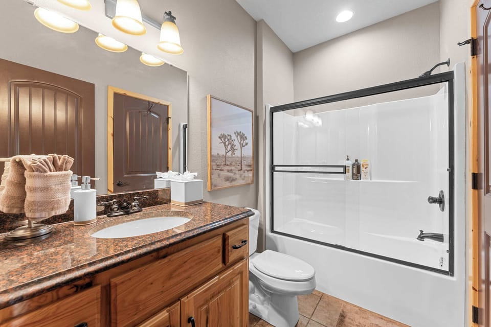The en suite bathroom also has access to the main area for additional guest use